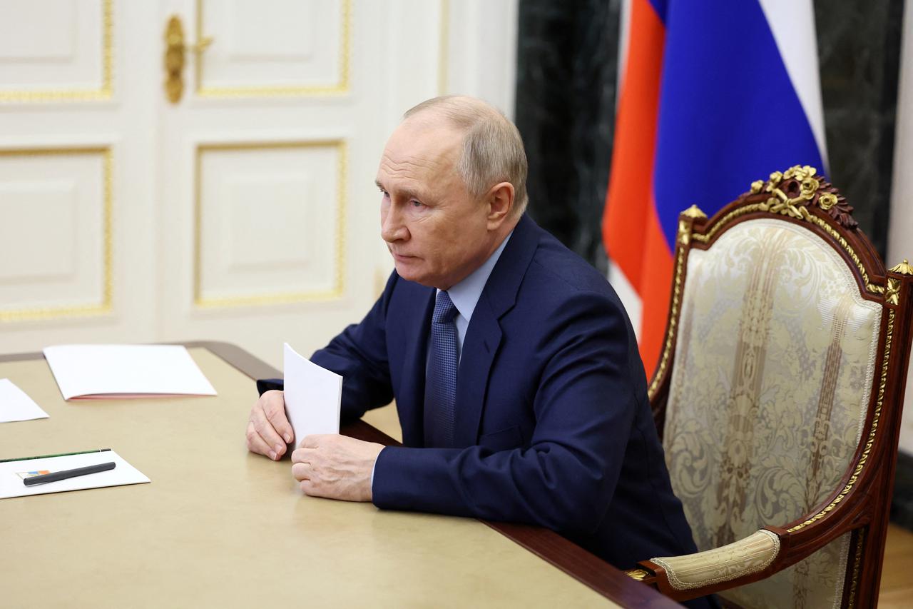 Russian President Putin chairs a meeting via video link in Moscow