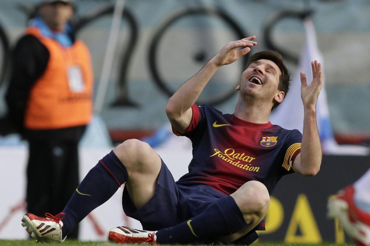 'Barcelona\'s Lionel Messi reacts during their Spanish First Division soccer match against Celta Vigo at the Balaidos stadium in Vigo March 30, 2013. REUTERS/Miguel Vidal (SPAIN - Tags: SPORT SOCCER)'