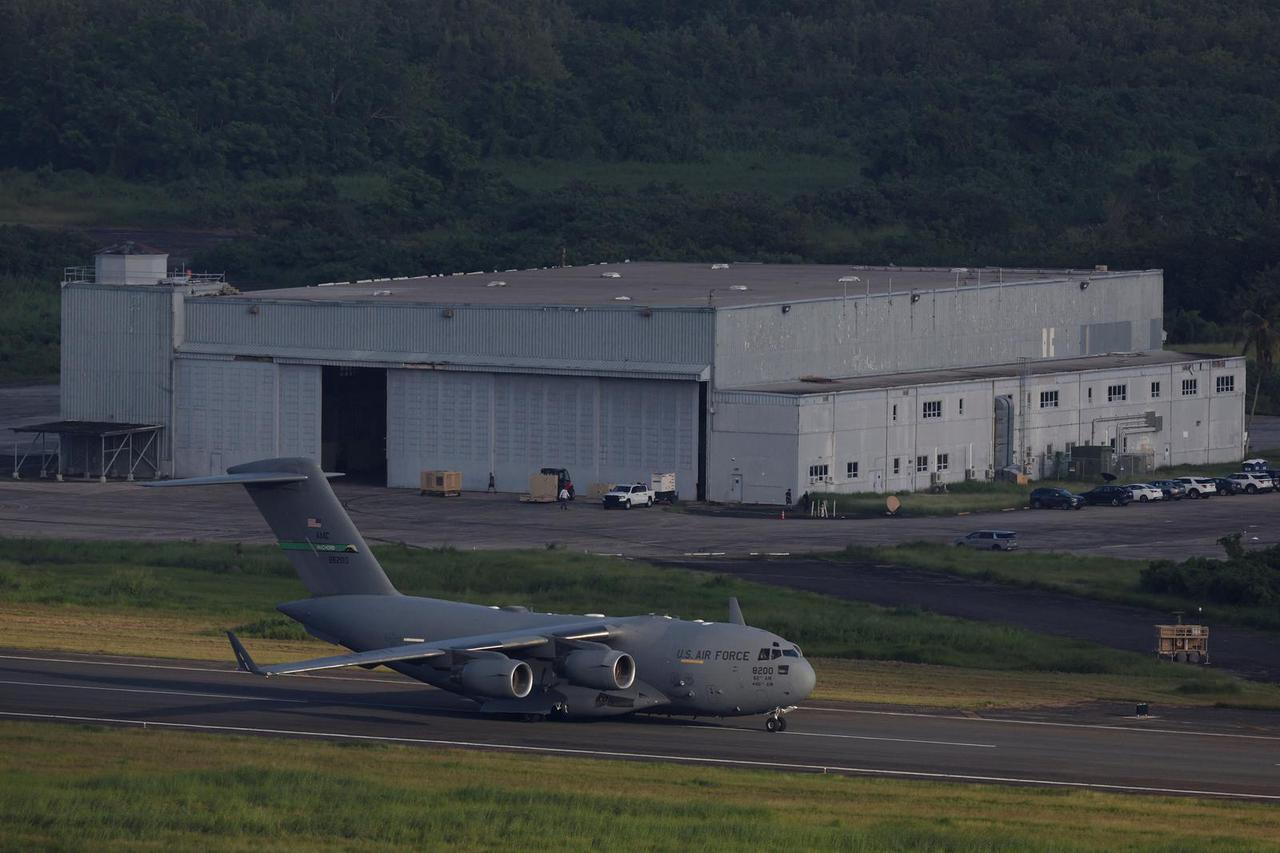 A U.S. Air Force C-17 Globemaster III taxis on the runway in front of a hangar formerly known as Building 200 at the former Roosevelt Roads Naval Station in Ceiba.