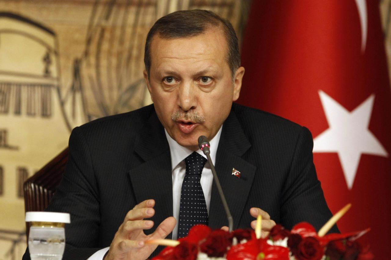 'Prime Minister Tayyip Erdogan gestures during a news conference after his meeting with Russia's President Vladimir Putin in Istanbul December 3, 2012. REUTERS/Osman Orsal (TURKEY - Tags: POLITICS)'
