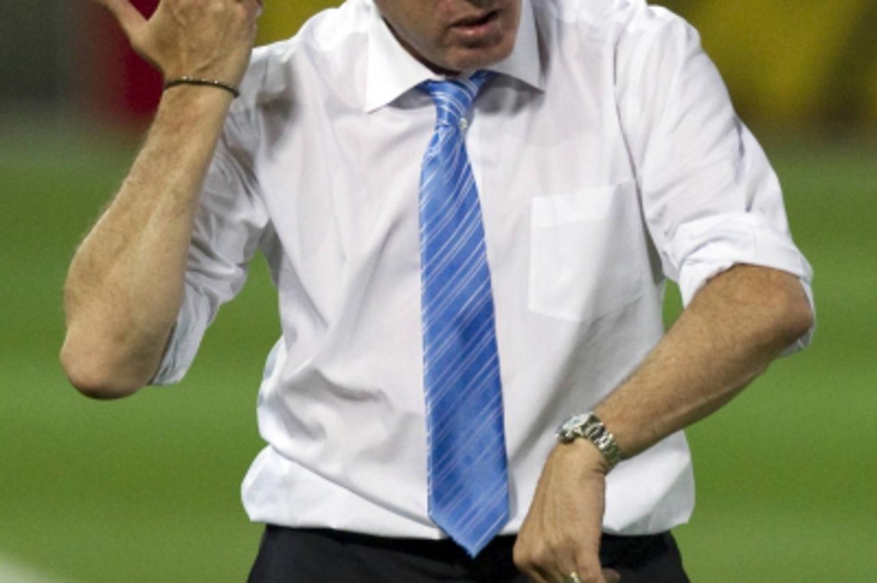 'Israel\'s Coach French Luis Fernandez reacts at the Bloomfield Staduim in Tel Aviv on March 29, 2011 during their Euro 2012 qualifying group F football match againts Georgia. AFP PHOTO / JACK GUEZ'