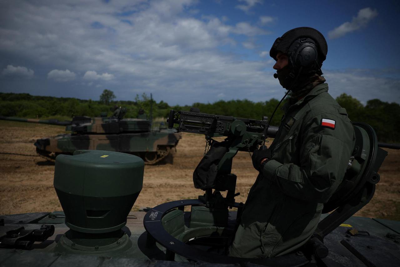 Polish soldiers ride a South Korean-made K2 Black Panther tank during a training exercise at a military ground in Braniewo