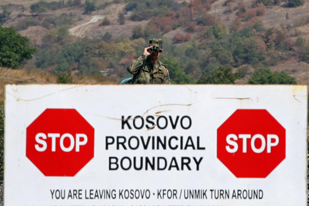 'A German KFOR soldier stands guard at the Jarinje border crossing between Serbia and Kosovo, on September 17, 2011. KFOR forces and Kosovo and European Union police and customs officers took control 