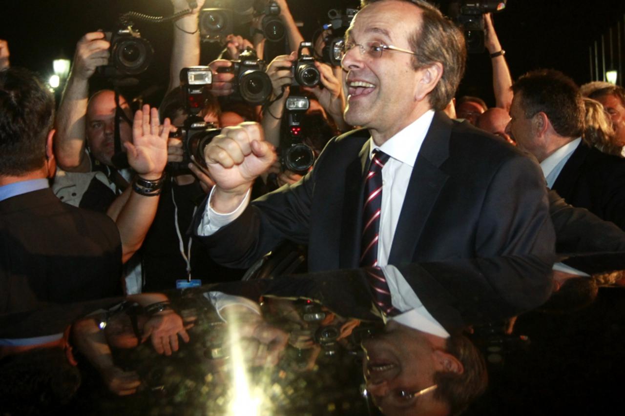 'Leader of conservative New Democracy party Antonis Samaras is cheered by supporters after his statement on the election results in Athens June 17, 2012. Samaras claimed victory in Sunday\'s national 