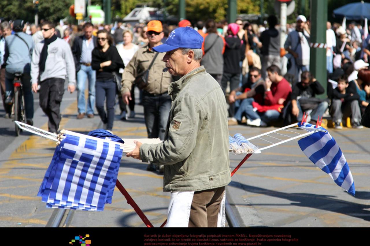 'People demonstrate in the streets of Athens, Greece, 19 October 2011. Greece\'s largest unions launched a 48-hour strike on 19 October 2011 crippling public services and shutting down schools, govern