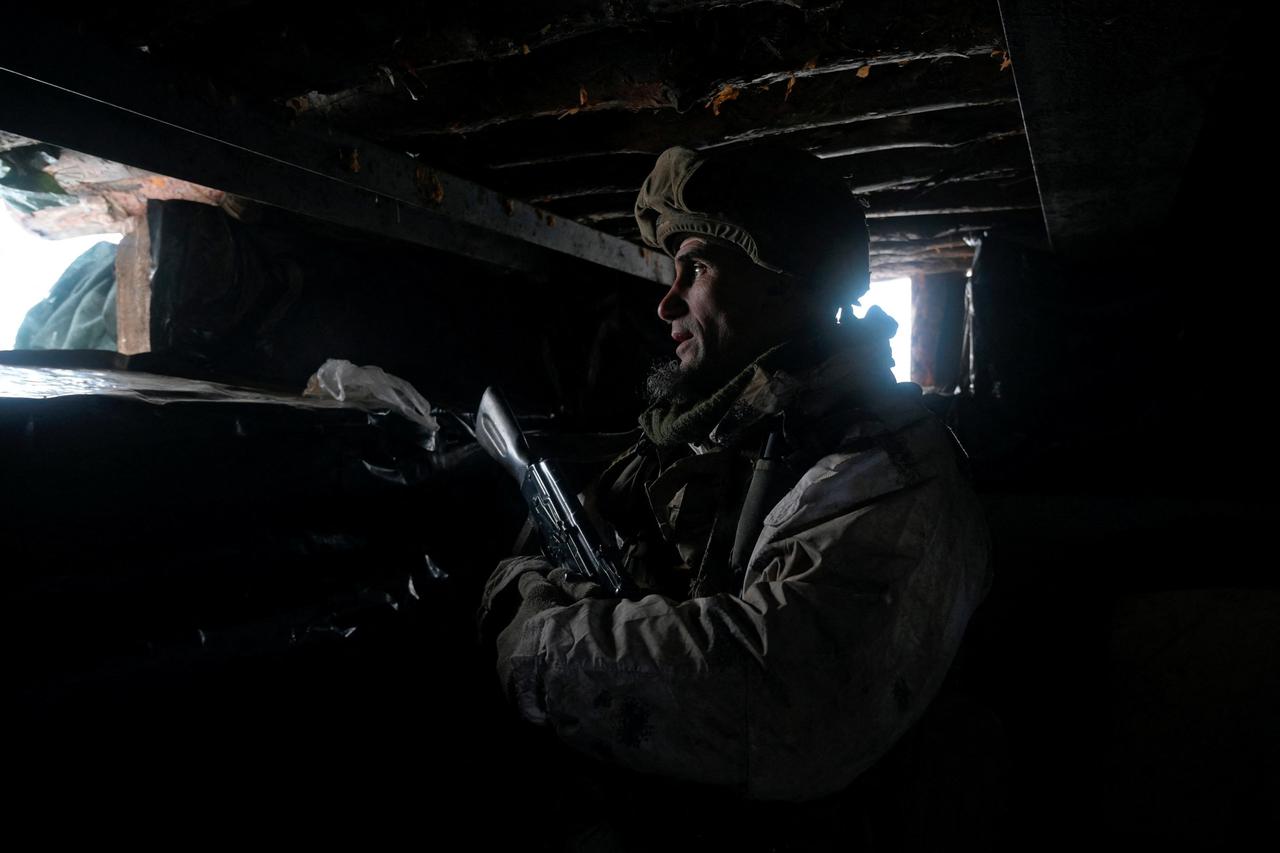 A service member of the Ukrainian armed forces is seen at combat positions in Donetsk Region