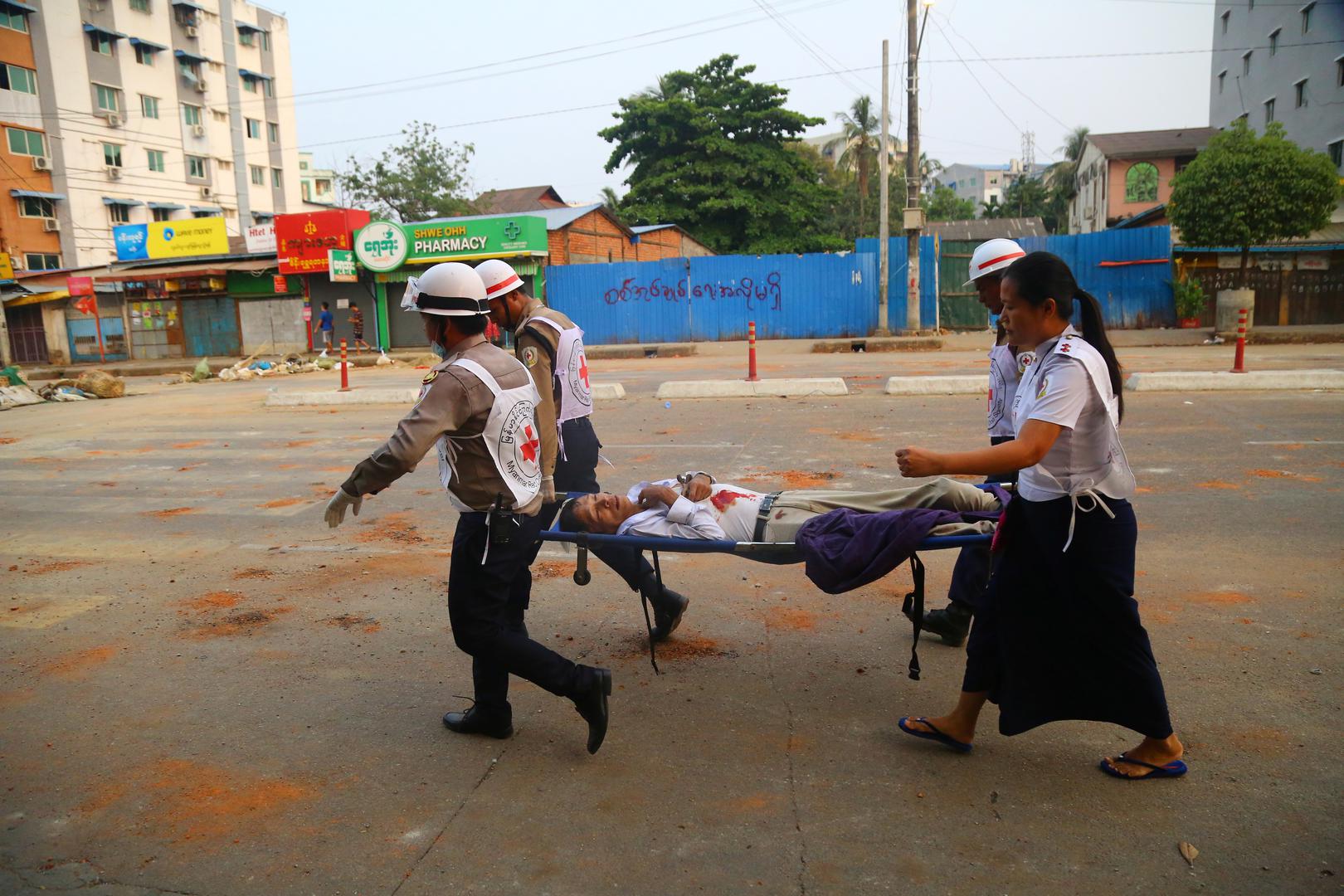 Myanmar red cross society volunteers carry a person who was shot during a security force crackdown on anti-coup protesters in Thingangyun, Yangon SENSITIVE MATERIAL. THIS IMAGE MAY OFFEND OR DISTURB    Myanmar red cross society volunteers carry a person who was shot during a security force crackdown on anti-coup protesters in Thingangyun, Yangon, Myanmar March 14, 2021. Picture taken on March 14, 2021. REUTERS/Stringer STRINGER