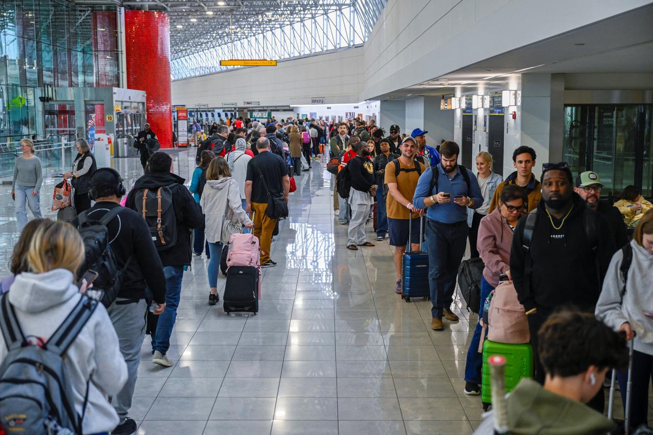 Passengers stand in long TSA lines at Baltimore/Washington International Thurgood Marshall Airport (BWI)