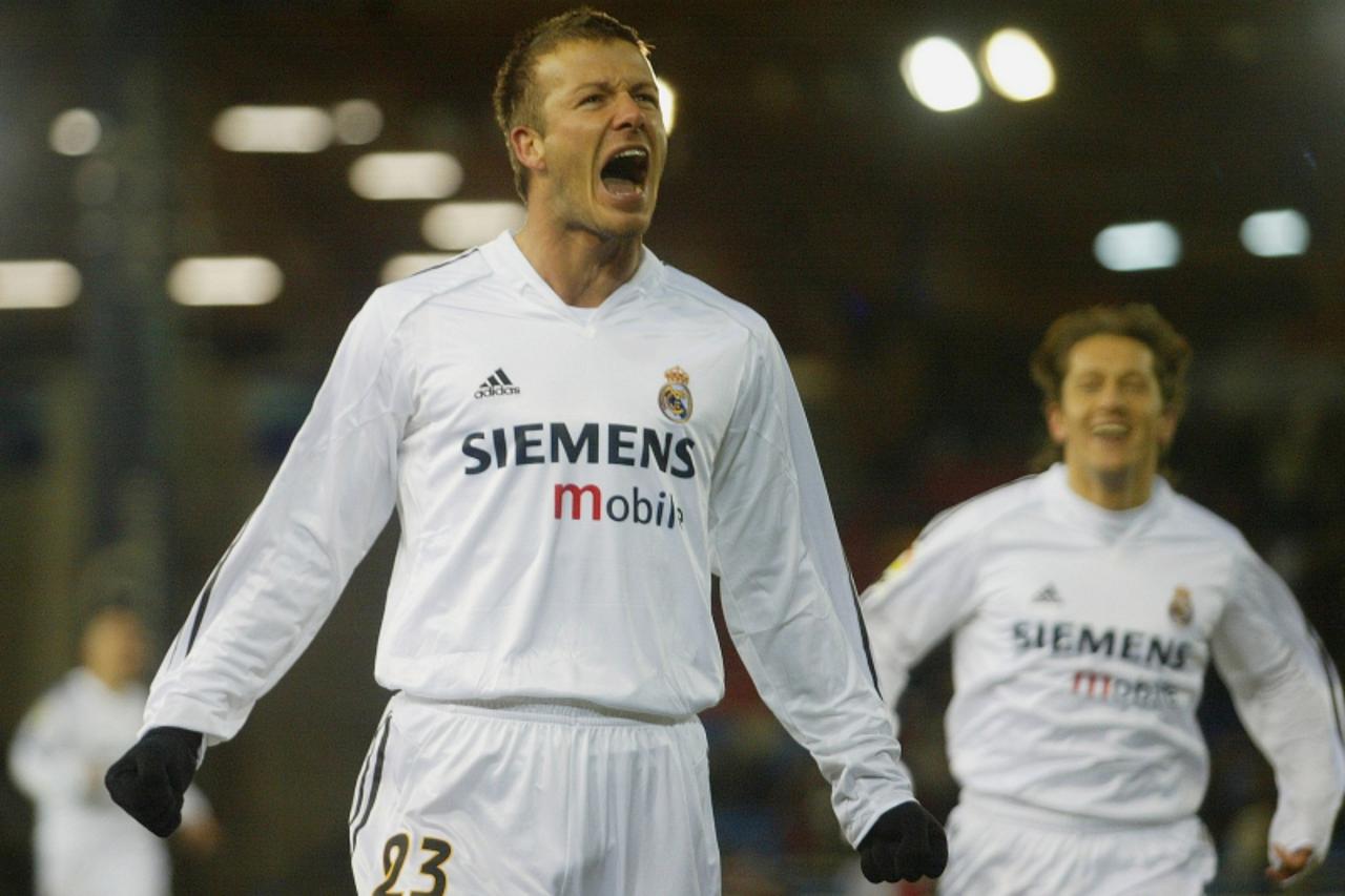 'Real Madrid\'s British midfielder David Beckham celebrates his goal after scoring a goal against Numancia during their Spanish first division match at the Los Pajaritos stadium in Soria, Spain, Janua
