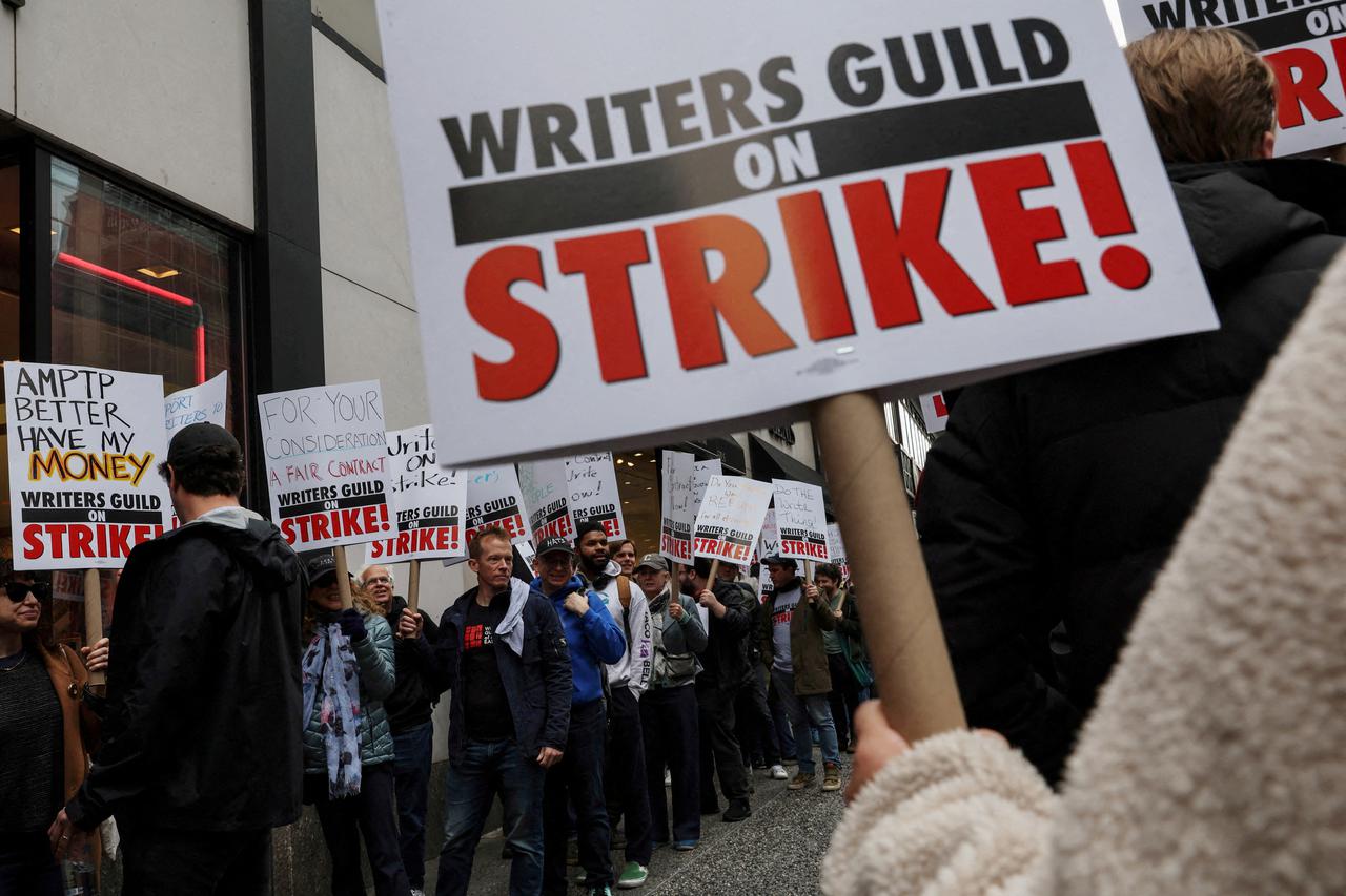 Members of the Writers Guild of America (WGA) East picket outside Peacock Newfront streaming service offices in New York City