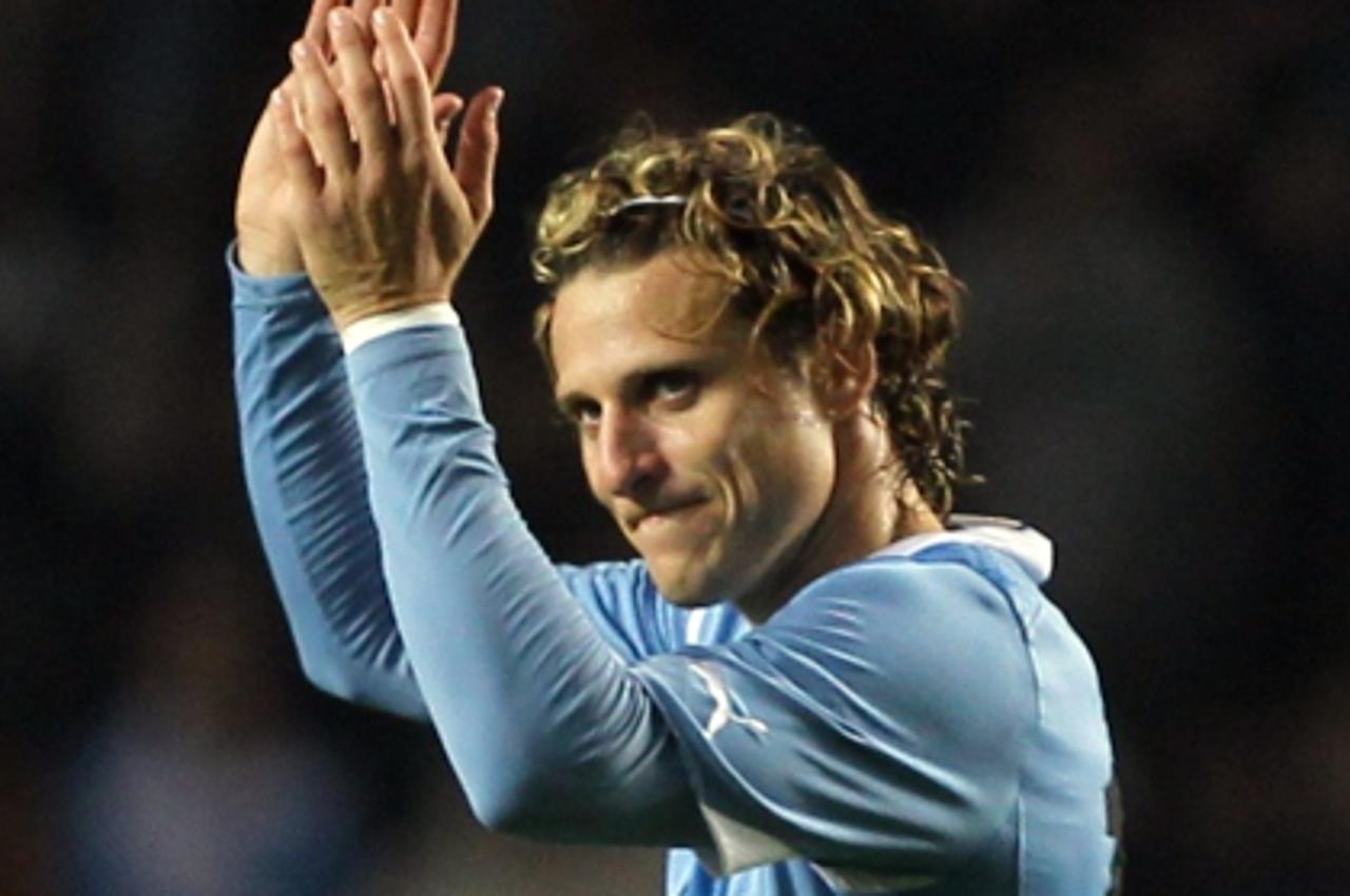 'Uruguayan forward Diego Forlan gestures at the end of the 2011 Copa America Group C first round football match against Mexico, at the Ciudad de La Plata stadium in La Plata, 59 Km south of Buenos Air
