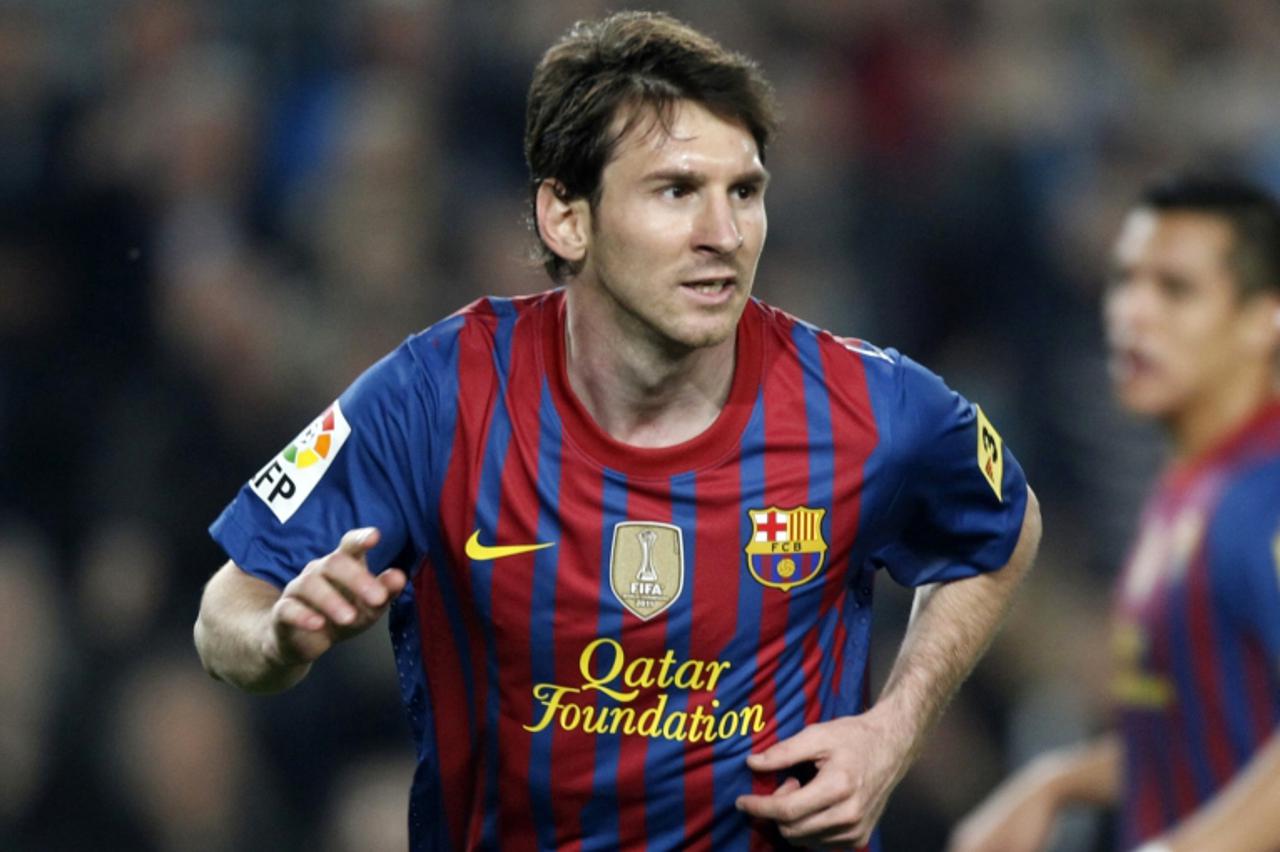 'Barcelona\'s Lionel Messi celebrates his goal against Athletic Bilbao during their Spanish first division soccer match at Nou Camp stadium in Barcelona, March 31, 2012.     REUTERS/Gustau Nacarino  (