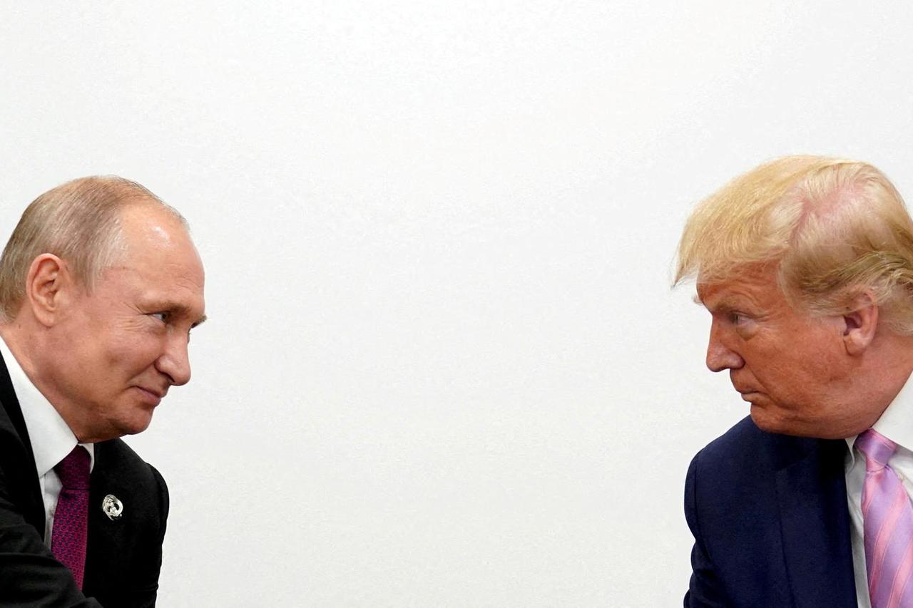 FILE PHOTO: FILE PHOTO: U.S. President Donald Trump and Russian President Vladimir Putin  at G20 leaders summit in Osaka