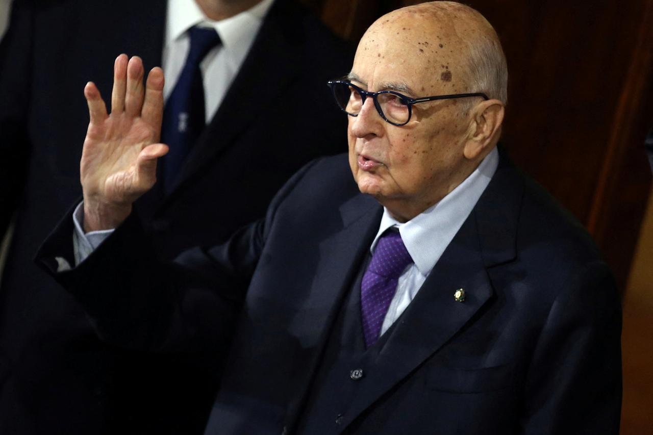 FILE PHOTO: Italian former President and senator Napolitano waves as he leaves at end of the first day of consultations with Italian President Mattarella at the Quirinale Palace in Rome