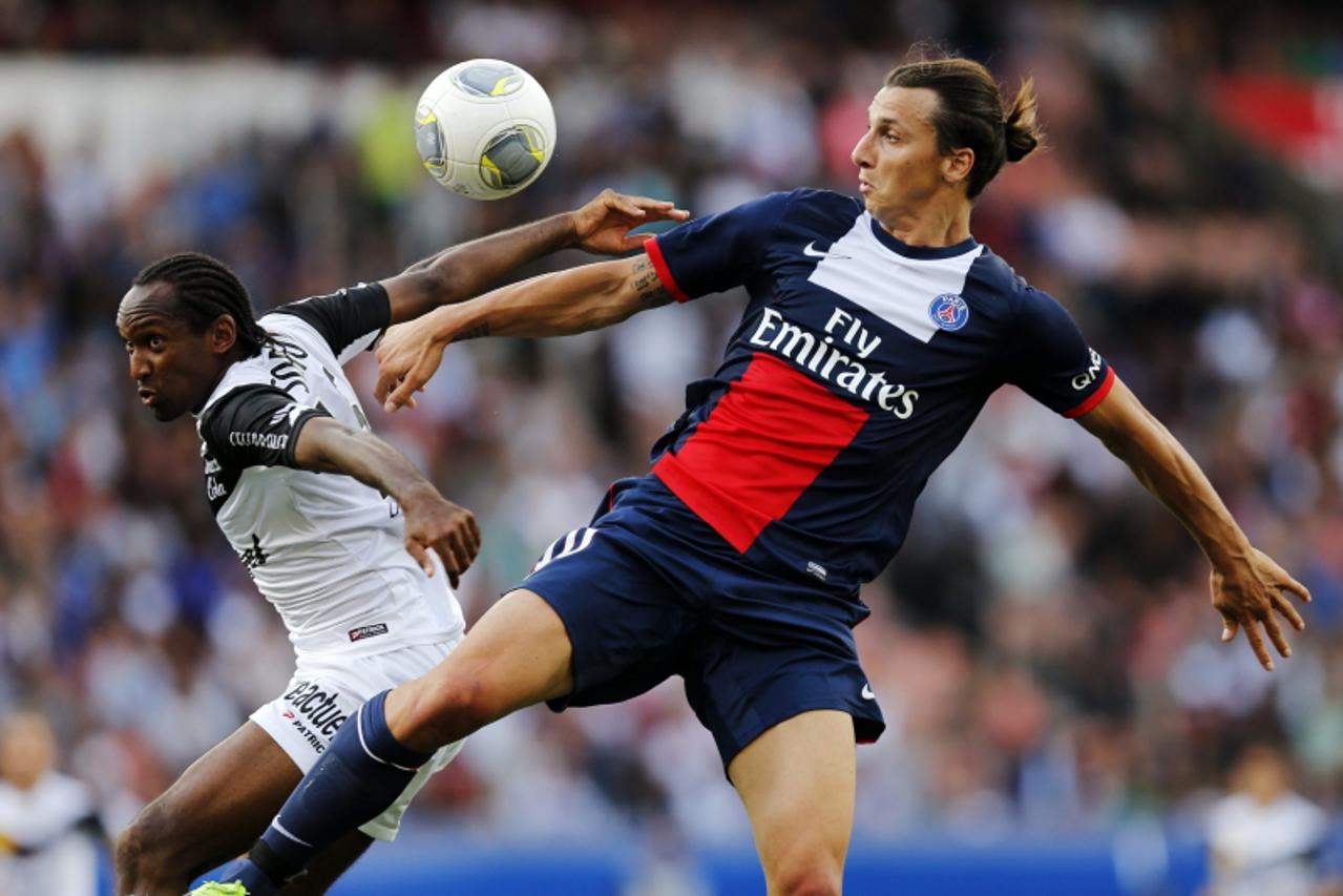 'Paris Saint-Germain's Zlatan Ibrahimovic (R) challenges Jeremy Sorbon of Guingamp during their French Ligue 1 soccer match at Parc des Princes stadium in Paris August 31, 2013. REUTERS/Benoit Tessie