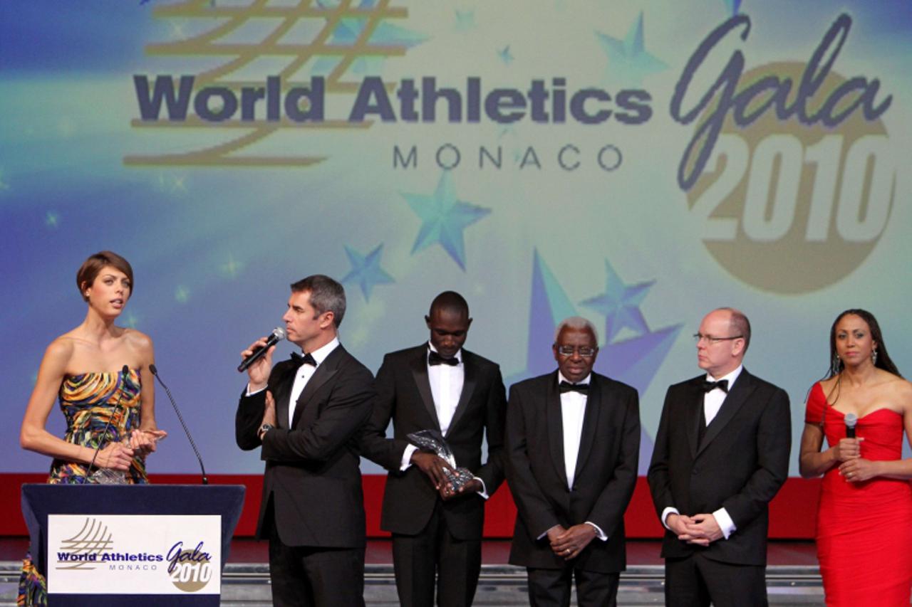 \'High jump Croatian athlete Blanka Vlasic (L) delivers a speech next to Middle distance runner Kenyan David Rudisha (3rd L), President of the International Association of Athletics Federations (IAAF)