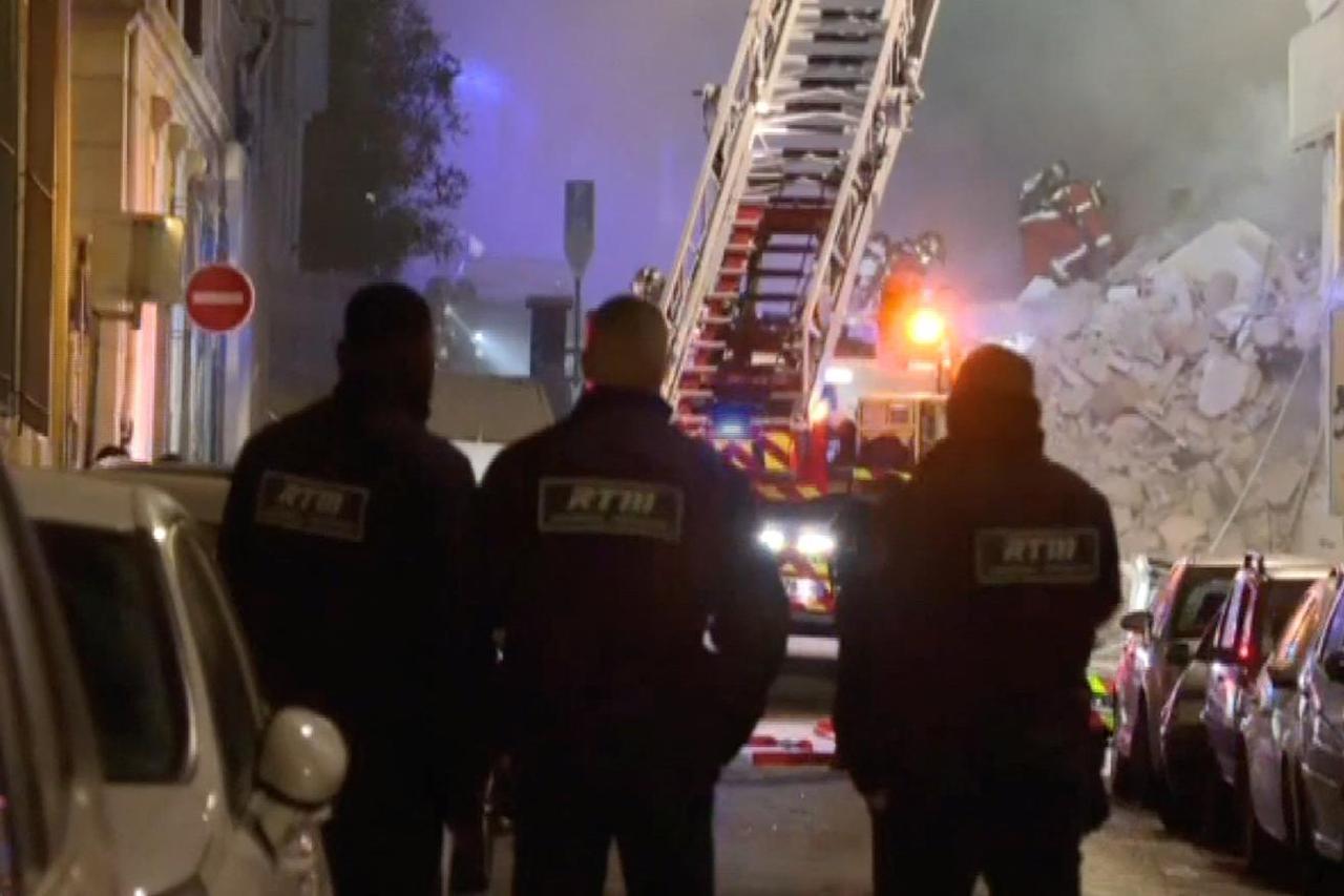 Firefighters work after a building collapsed in Marseille