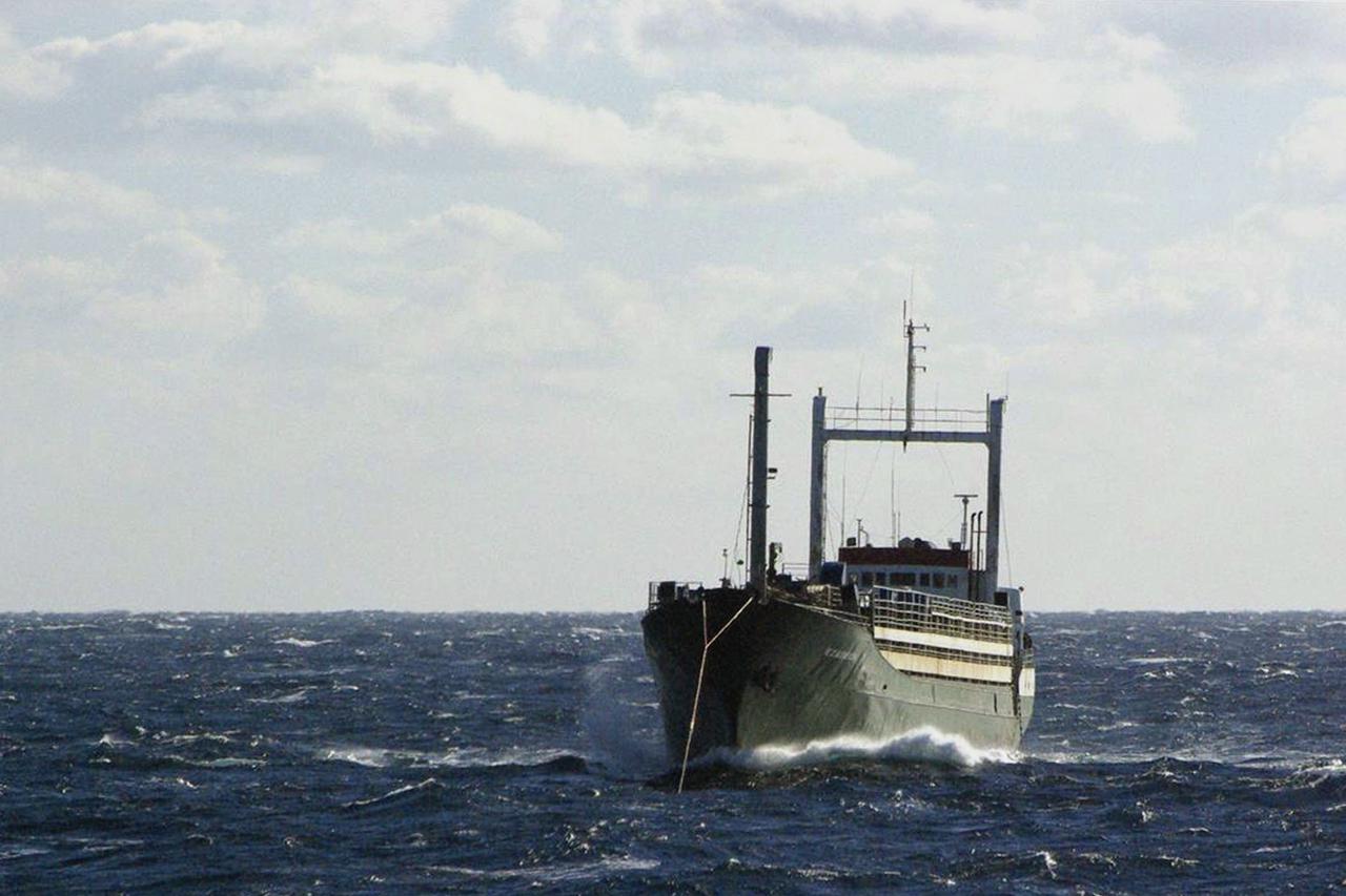Sierra Leone-flagged Ezadeen vessel, carrying hundreds of migrants, is towed by the Icelandic Coast Guard vessel Tyr in rough seas in the Mediterranean sea off Italy's south coast in this handout provided by the Icelandic Coast Guard January 2, 2015. Coas