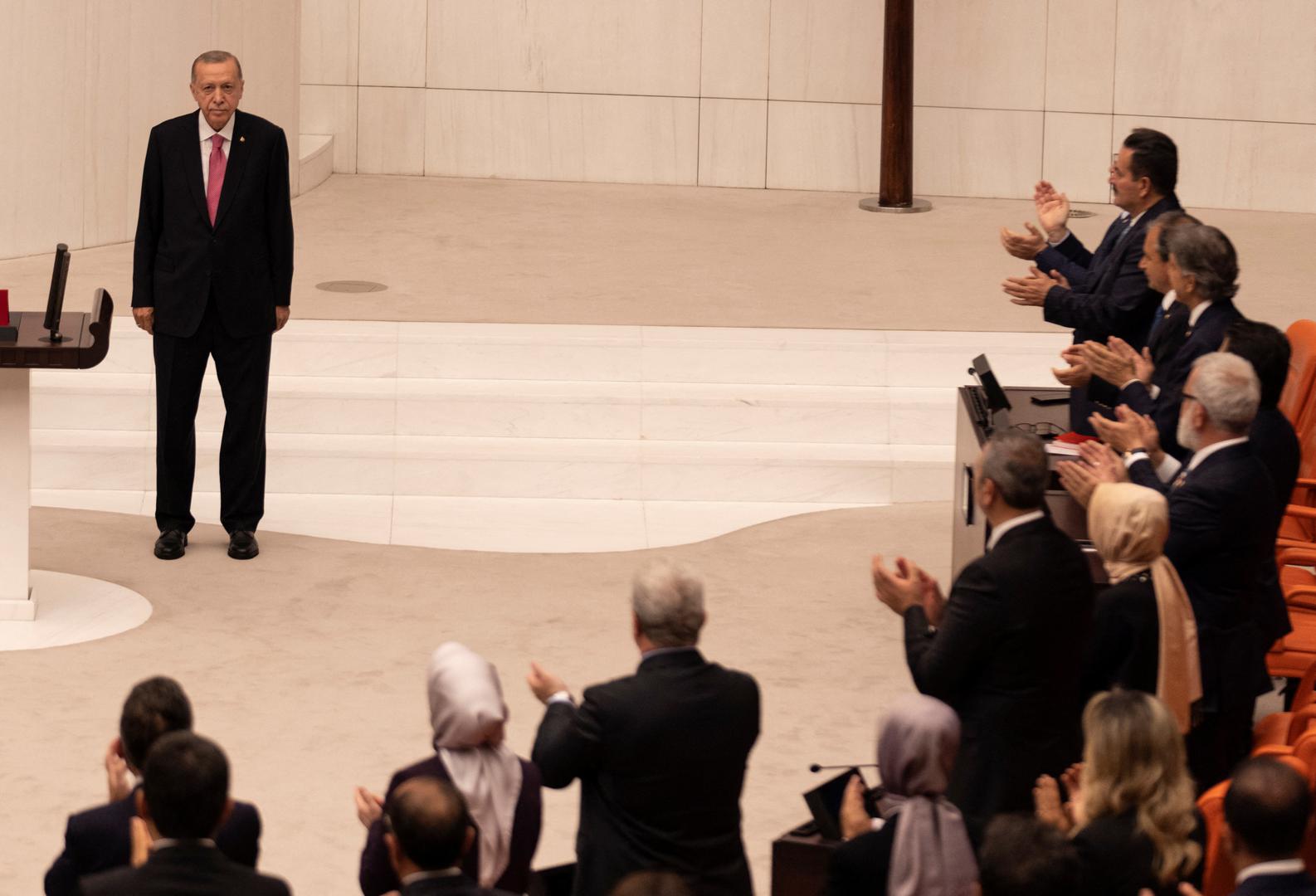 Turkish President Tayyip Erdogan greets members of the parliament and guests as he arrives to take his oath after his election win in Ankara, Turkey, June 3, 2023. REUTERS/Umit Bektas Photo: UMIT BEKTAS/REUTERS