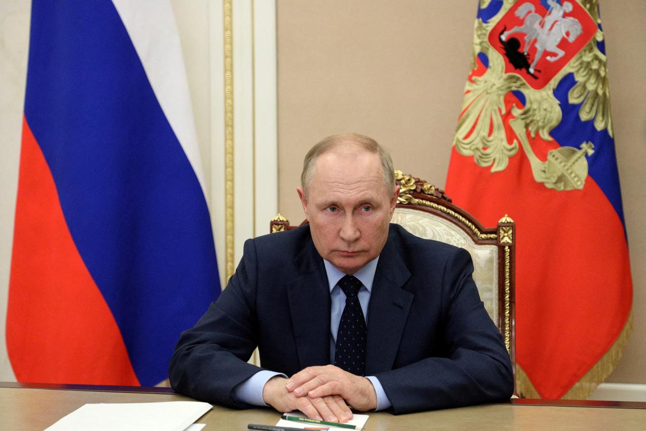 FILE PHOTO: Russian President Vladimir Putin attends a meeting with acting Governor of Kirov region Alexander Sokolov via a video link in Moscow