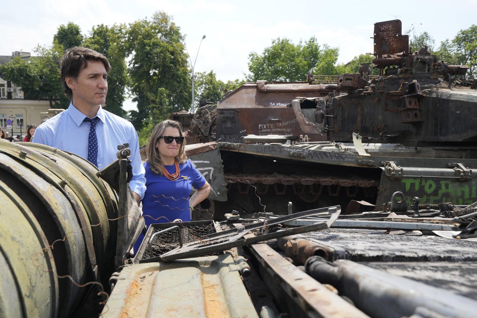 Prime Minister Justin Trudeau and Deputy Prime Minister Chrystia Freeland look at burned out Russian tanks in Kyiv, Ukraine, on Saturday, June 10, 2023. THE CANADIAN PRESS/Frank Gunn Photo: Frank Gunn/PRESS ASSOCIATION