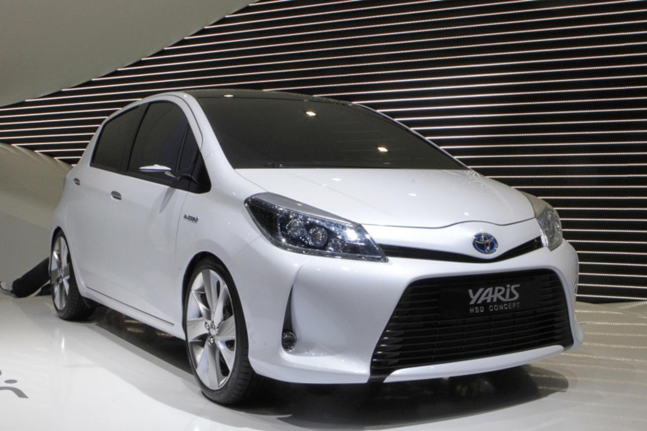 'A new Toyota Yaris HSD Concept hybrid car is displayed during the first media day of the 81st Geneva Car Show at the Palexpo in Geneva March 1, 2011.  REUTERS/Denis Balibouse (SWITZERLAND  - Tags: TR