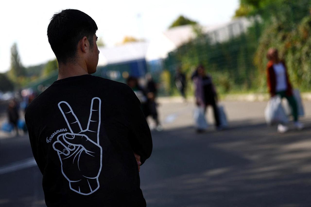A refugee stands at the first reception center for refugees in Giessen