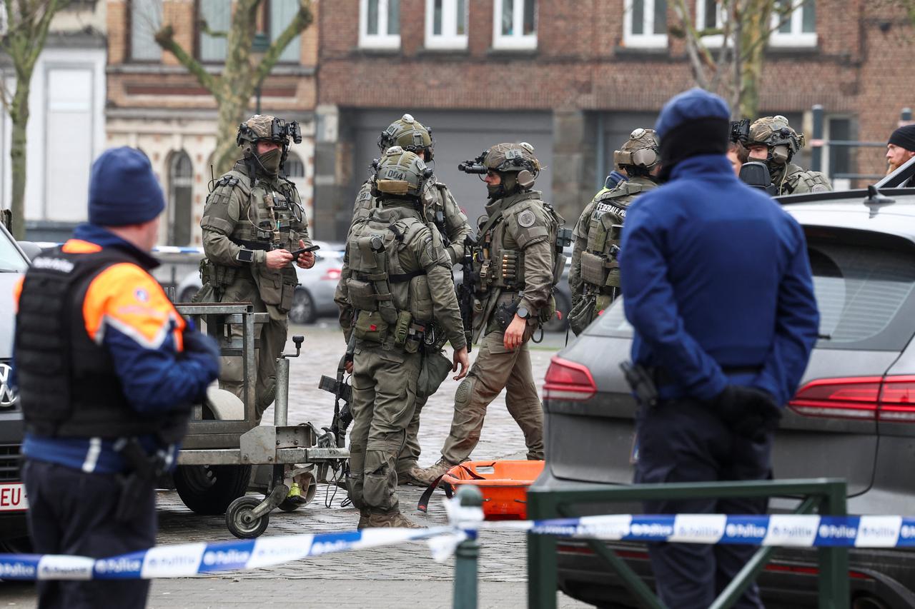 Police members work at the Clemenceau metro station, after a shooting took place in Brussels