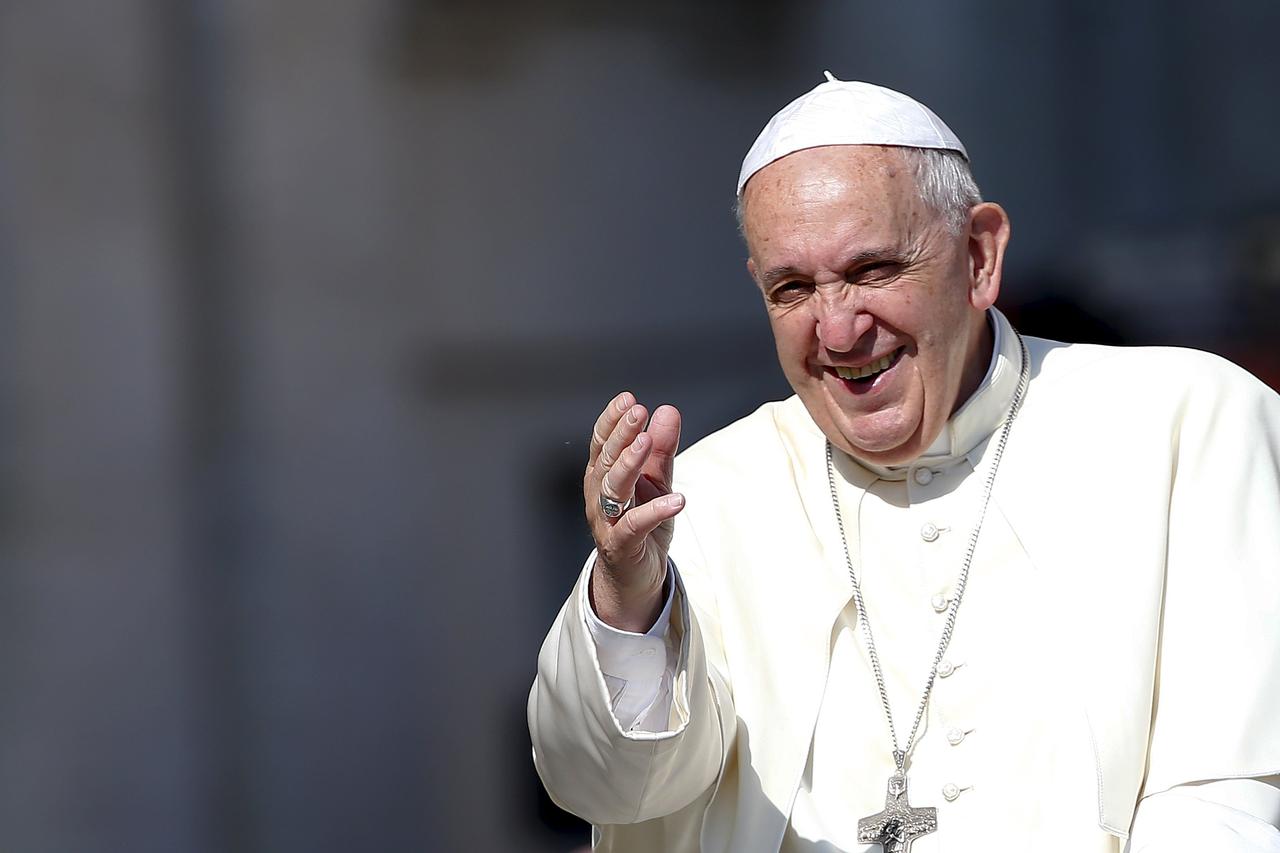 Pope Francis waves as he arrives to lead his Wednesday general audience in Saint Peter's square at the Vatican June 10, 2015. REUTERS/Tony Gentile