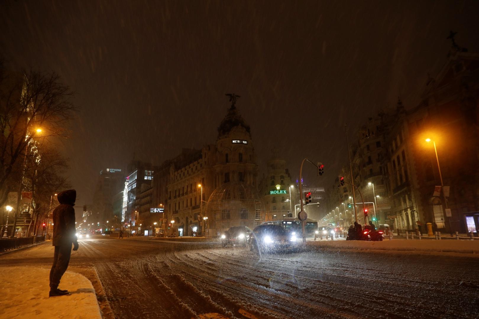 Heavy snowfall in Madrid A person waits for the bus amid heavy snowfall in Madrid, Spain January 8, 2021. REUTERS/Susana Vera SUSANA VERA
