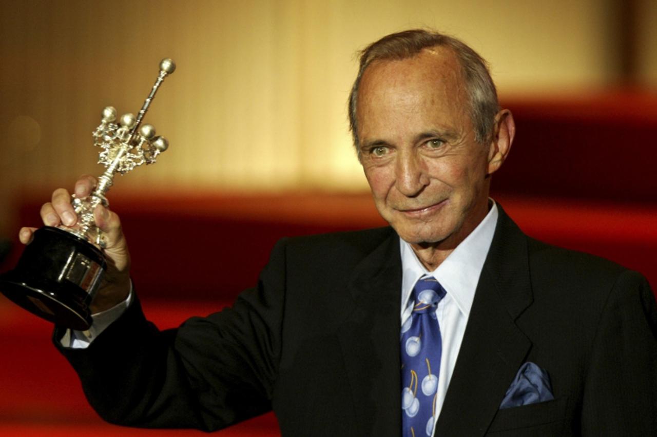 'U.S. actor Ben Gazzara holds his Donostia prize which was awarded in recognition of his lifetime achievement at the San Sebastian Film Festival in northern Spain in this file photo taken September 22