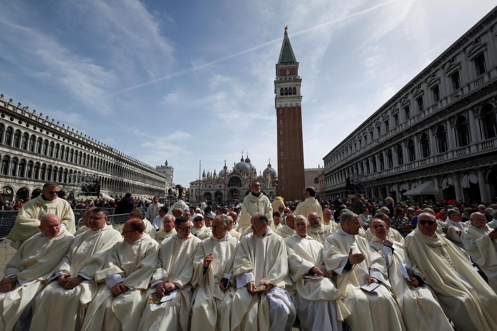 Members of the clergy sit in Saint Mark's Square, on the day Pope Francis celebrates the Holy Mass, in Venice, Italy, April 28, 2024. REUTERS/Yara Nardi Photo: YARA NARDI/REUTERS