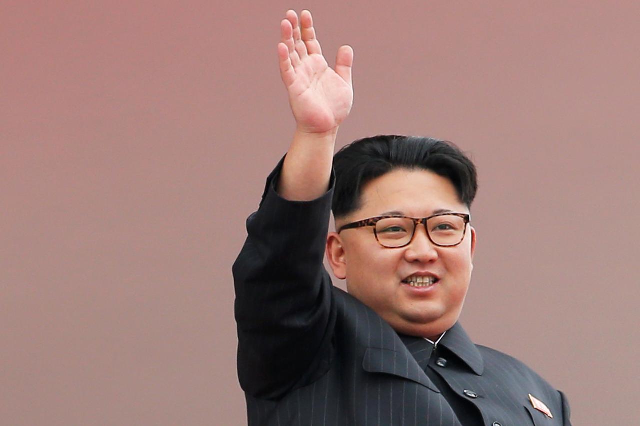 North Korean leader Kim Jong Un waves to the crowd as he presides over a mass rally and parade in the capital's main ceremonial square, a day after the ruling party wrapped up its first congress in 36 years by elevating him to party chairman, in Pyongyang
