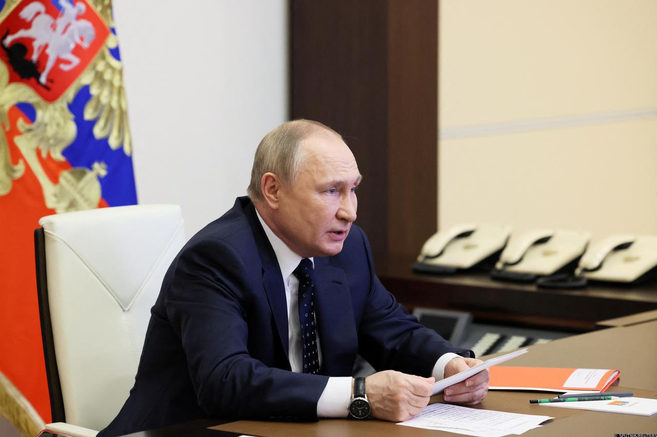 Russian President Putin chairs a meeting with members of the Security Council outside Moscow