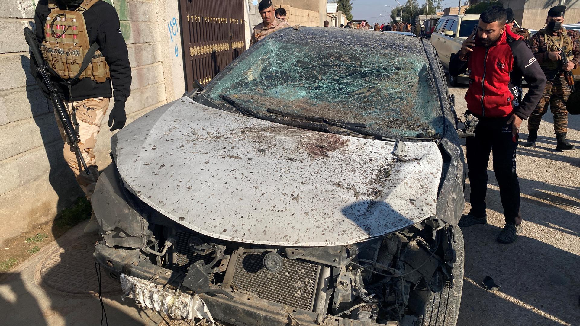 Security forces inspect a damaged car at the site of a U.S. airstrike in al-Qaim, Iraq February 3, 2024. REUTERS/Stringer  NO RESALES. NO ARCHIVES Photo: Stringer/REUTERS