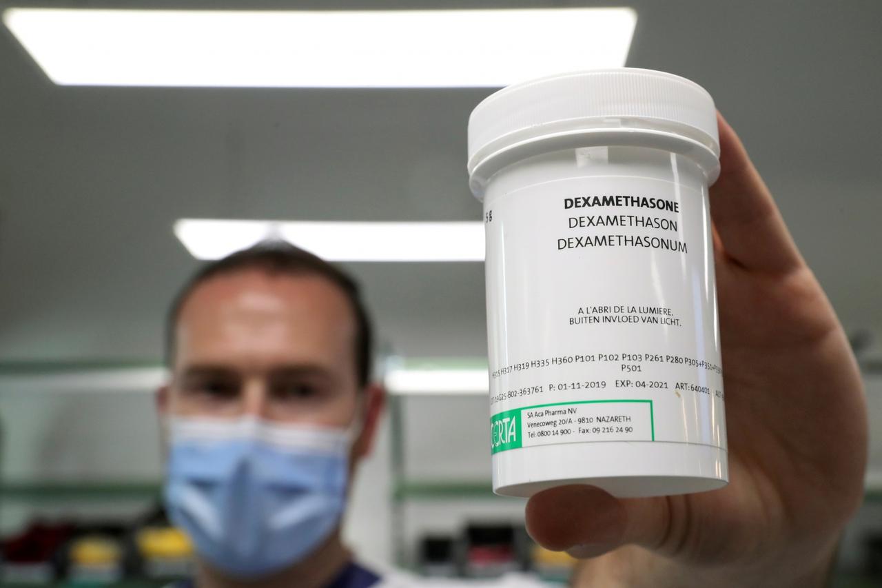 FILE PHOTO: A pharmacist displays a box of Dexamethasone at the Erasme Hospital amid the coronavirus disease (COVID-19) outbreak, in Brussels