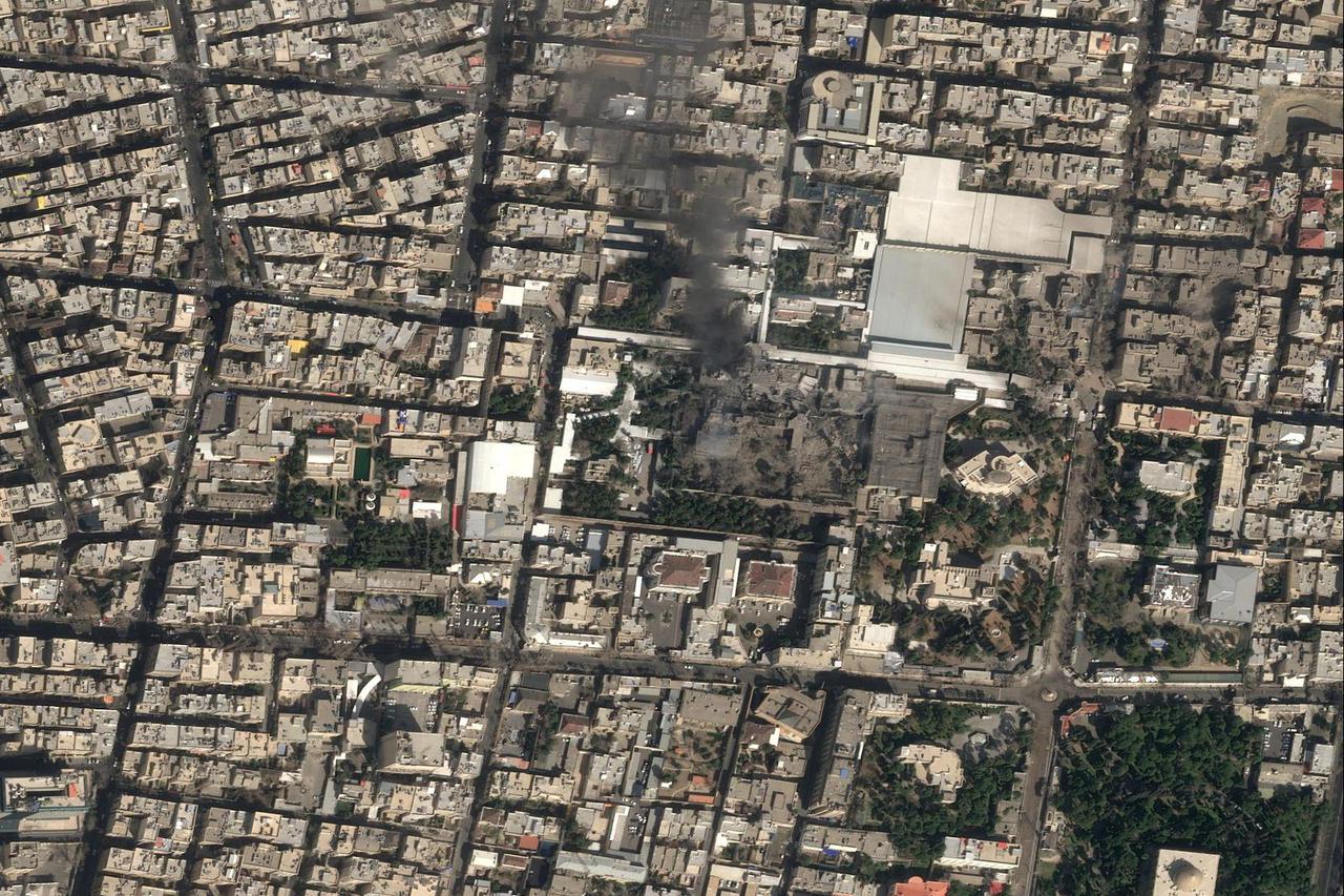 A satellite image shows black smoke rising and heavy damage at Iranian Supreme Leader Ayatollah Ali Khamenei's compound in Tehran