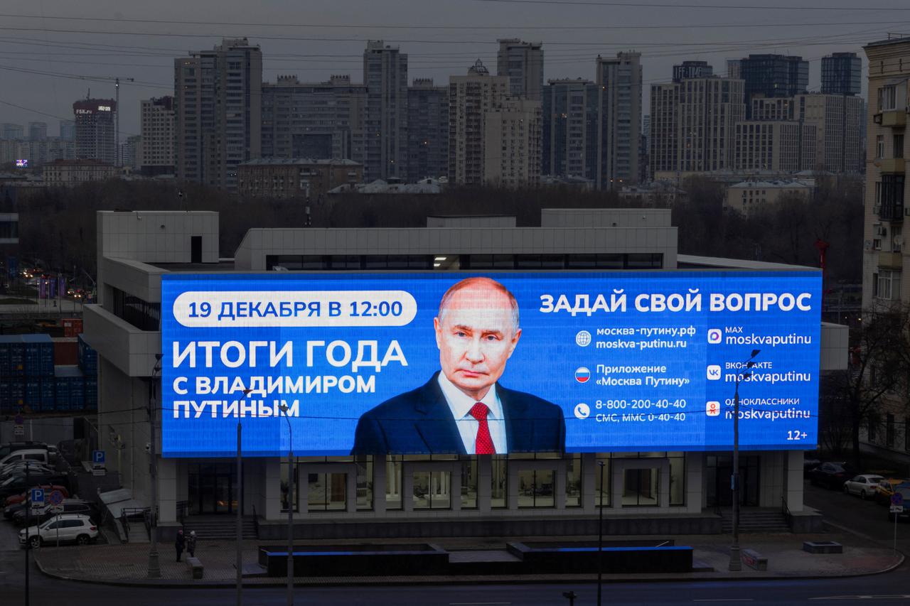 A screen promotes Russian President Putin's upcoming press conference in Moscow