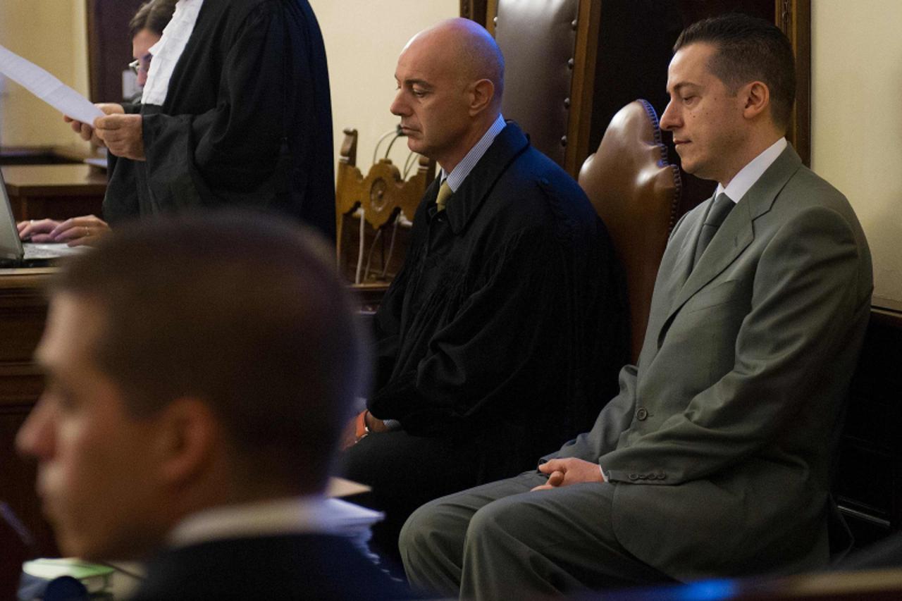 'Pope Benedict\'s former butler Paolo Gabriele (R), accused of stealing and leaking the pontiff\'s personal papers, sits at the start of his trial at the Vatican September 29, 2012. Gabriele went on t