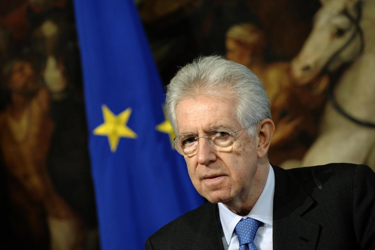 \'Italian Prime Minister Mario Monti looks on during a meeting with Secretary General of the Organization for Economic Cooperation and Development Angel Gurria at Chigi palace in Rome February 6, 2012