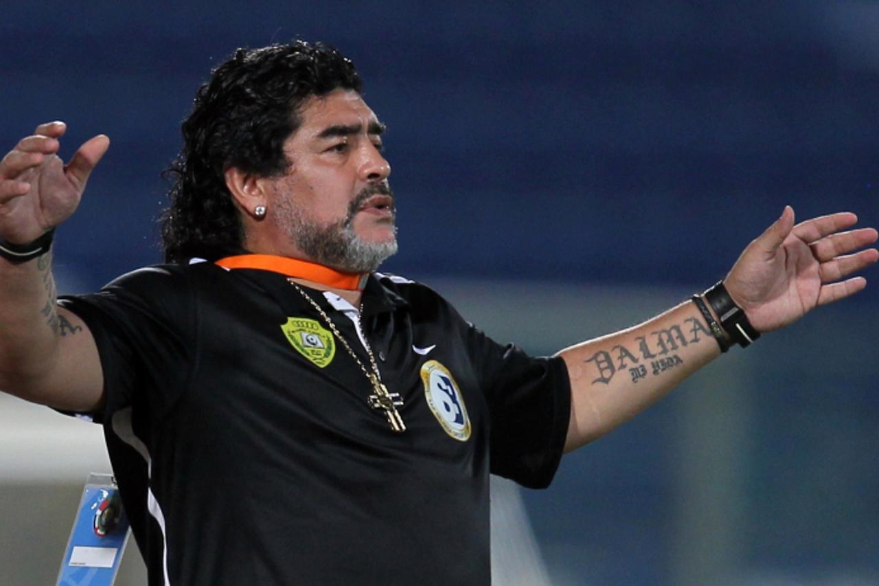 'Argentine football legend Diego Maradona, coach of UAE\'s Al-Wasl, reacts during his team\'s GCC Champions League football match against Qatar\'s Al-Khor in Doha on May 30, 2012. AFP PHOTO/KARIM JAAF