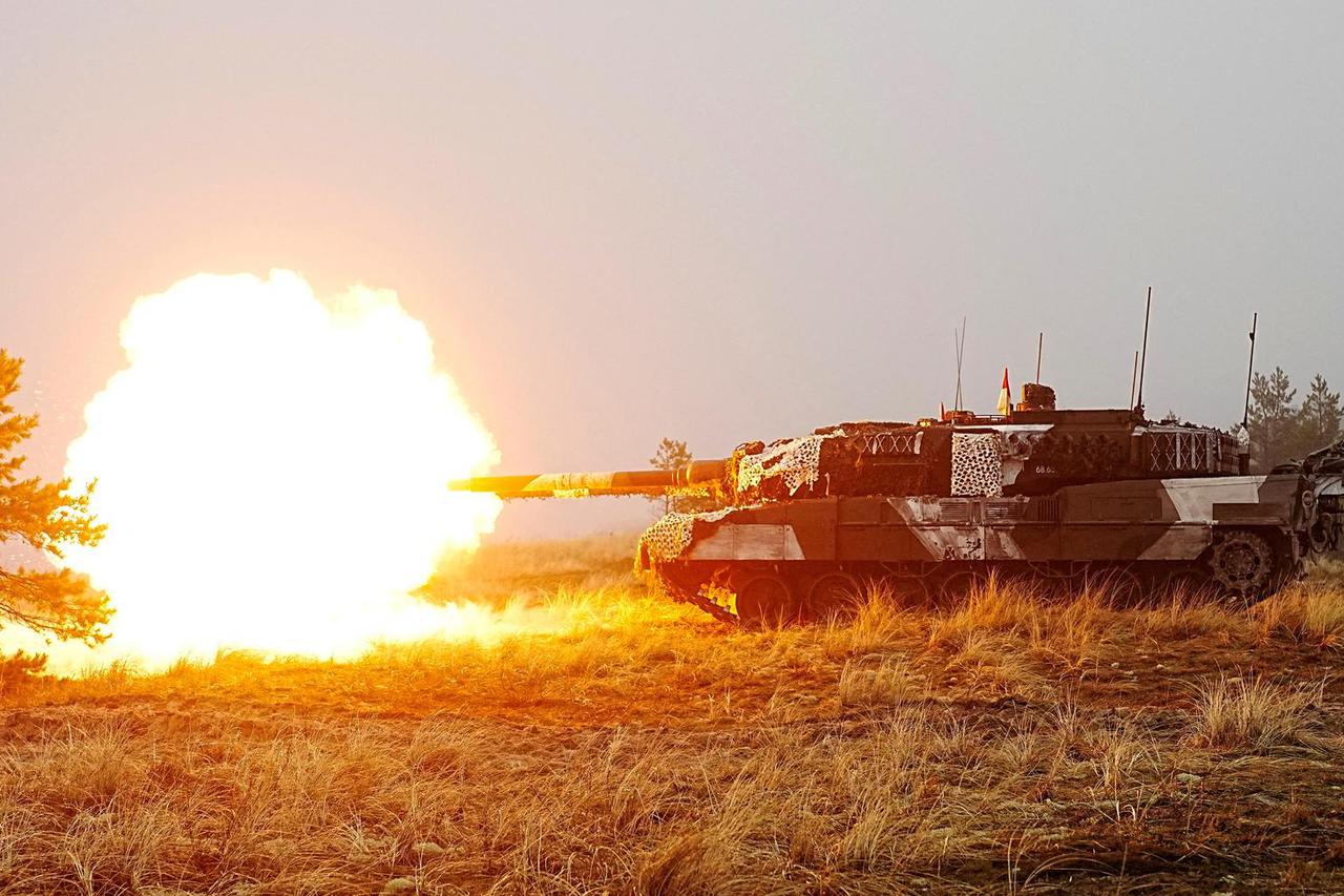 FILE PHOTO: Danish army Leopard 2A7 tanks and Estonian army CV-90 infantry fighting vehicles attend live shooting exercise in Perakula