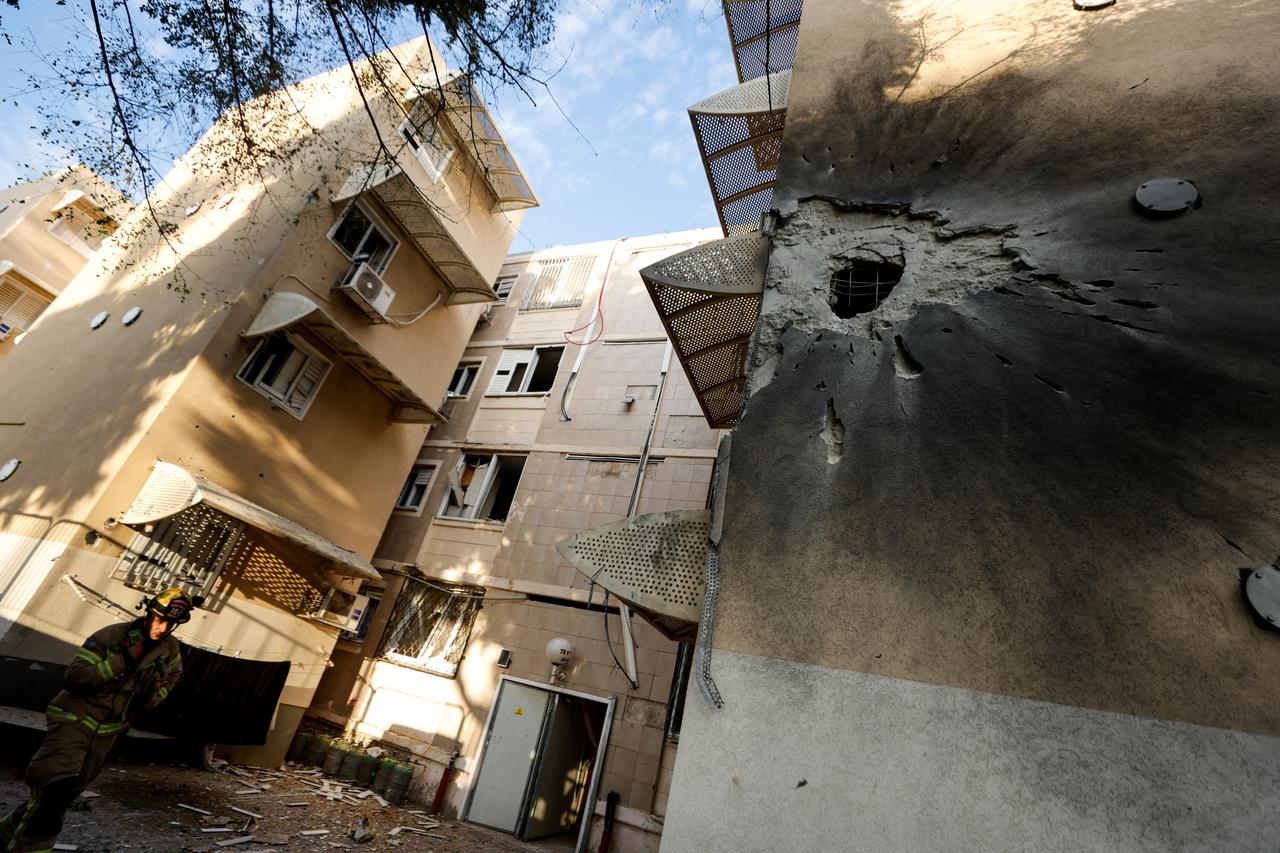 A damaged home is seen after it was hit by a rocket launched from the Gaza Strip into Israel, in Sderot, southern Israel