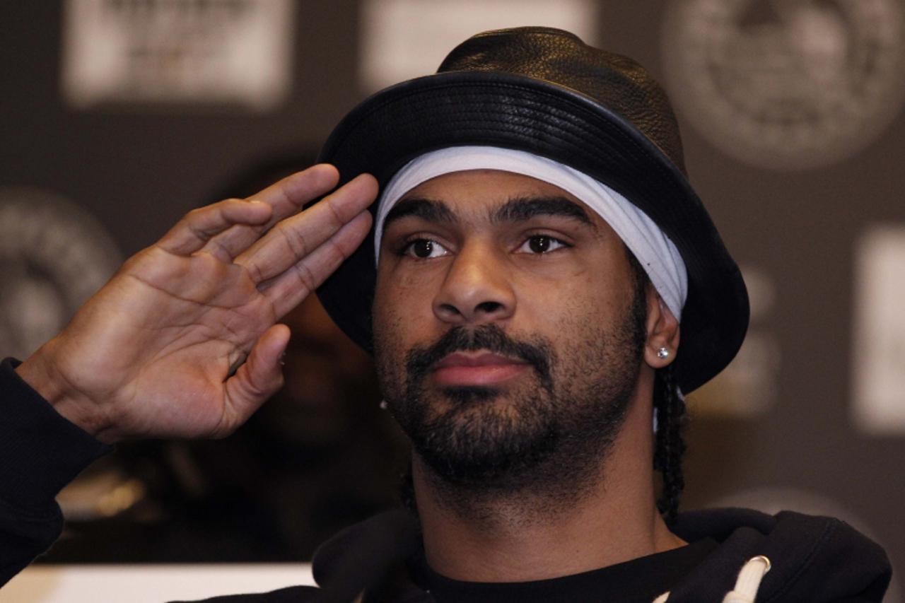 'David Haye of Britain gestures during a news conference with John Ruiz of the U.S at Manchester town hall in  northern England April 1, 2010 The pair will fight for the WBA heavyweight world title  M
