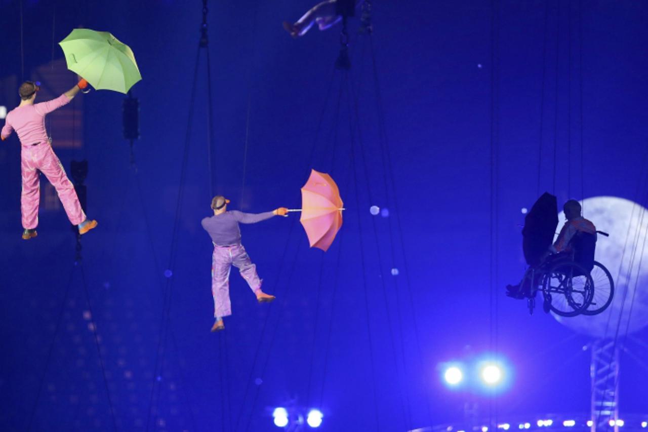 'Performers are lifted into the air in the Olympic Stadium during the opening ceremony of the London 2012 Paralympic Games August 29, 2012.        REUTERS/Olivia Harris (BRITAIN  - Tags: SPORT OLYMPIC