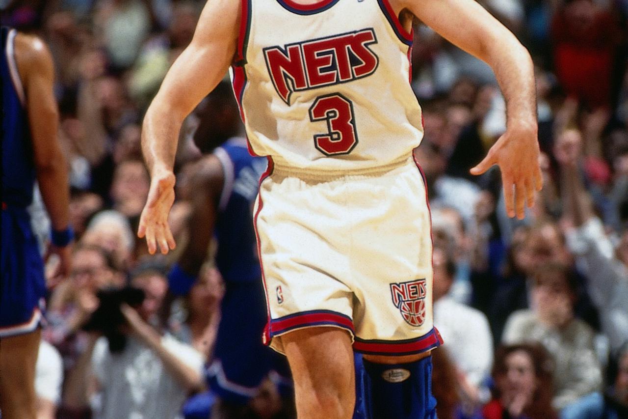 EAST RUTHERFORD, NJ - 1993:  Drazen Petrovic #3 of the New Jersey Nets celebrates against the Cleveland Cavaliers during Game three of Round one of the 1993 NBA Playoffs circa 1993 at Brendan Byrne Arena in East Rutherford, New Jersey.  NOTE TO USER: User