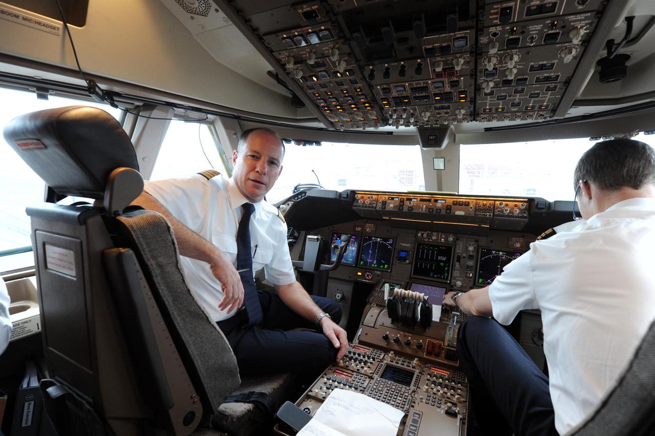 Captain Sergio De Witt (L) and his co-pilot Daniel Schaefer (R) sit in the cockpit of a Boeing 747-8 Intercontinental jet airliner at the airport in Munich, Germany, 21 November 2012. Airline Lufthansa acquired the new version of the jez airliner in May 2