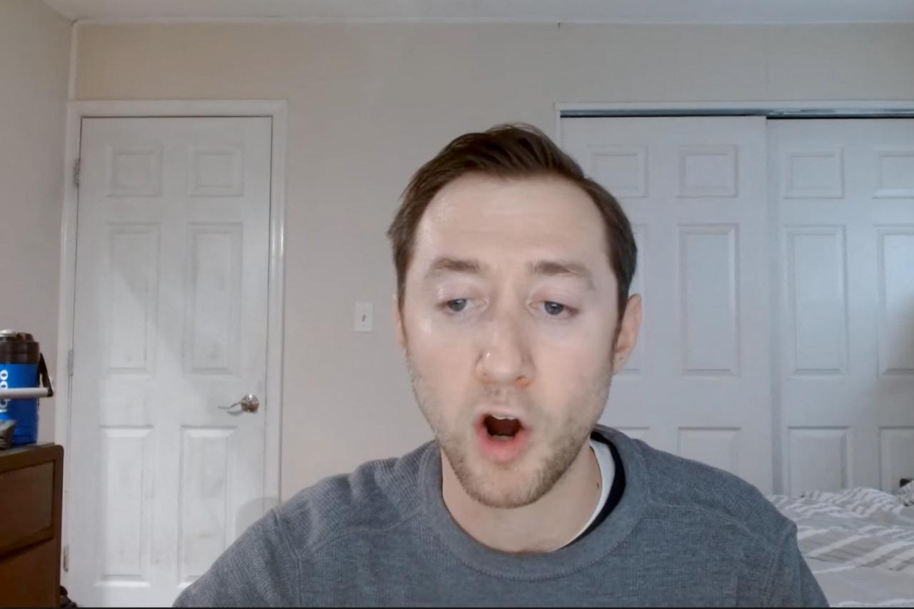 Justin Mohn speaks on a Youtube broadcast from his home in the Levittown