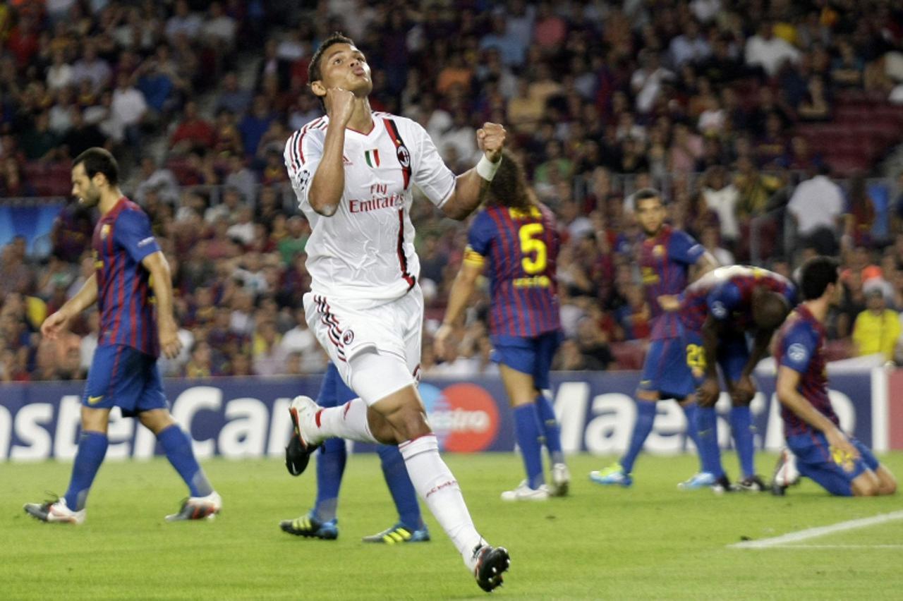 'AC Milan\'s Thiago Silva celebrates scoring a goal against Barcelona in the final minute to equalise during their Group H Champions League soccer match at the Nou Camp stadium in Barcelona September 