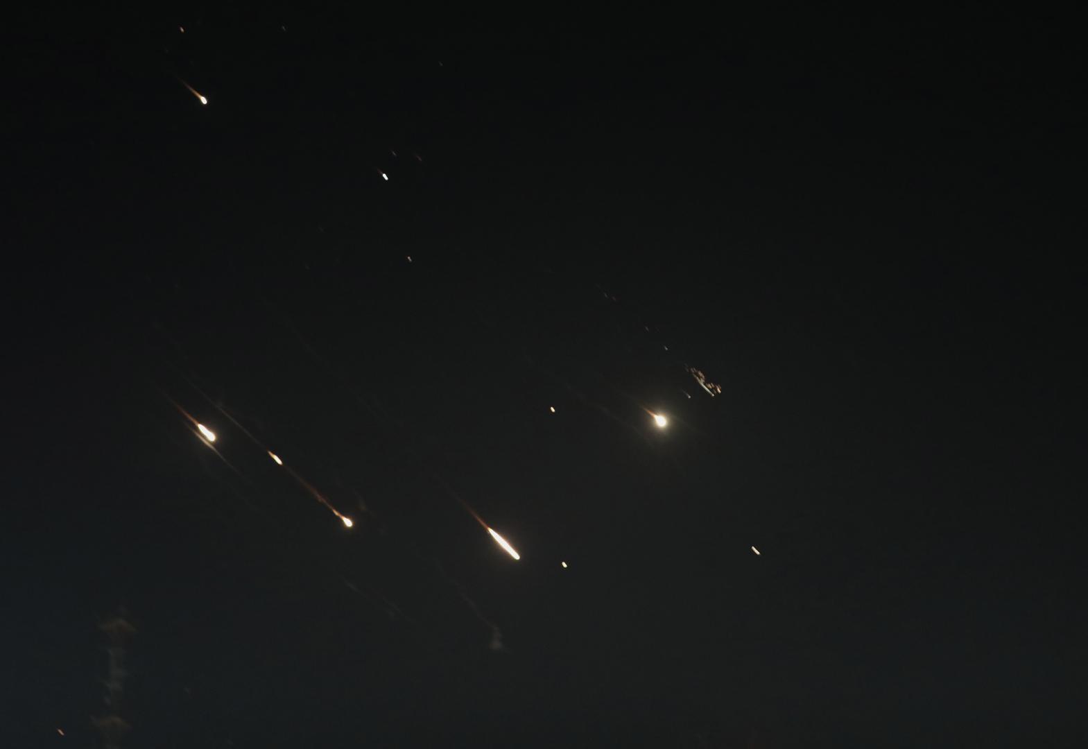 (240414) -- JERUSALEM, April 14, 2024 (Xinhua) -- This photo taken on April 14, 2024 shows flares from explosions in the sky over Jerusalem as Israel's Iron Dome anti-missile system intercepts missiles and drones from Iran. A combined attack of dozens of ballistic missiles and hundreds of drones from Iran triggered air raid alerts across Israel early on Sunday, the Israeli army said, as residents reported multiple bombings were heard. (Photo by Jamal Awad/Xinhua) Photo: Jamal Awad/XINHUA